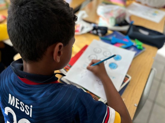 Image of a boy creating artwork